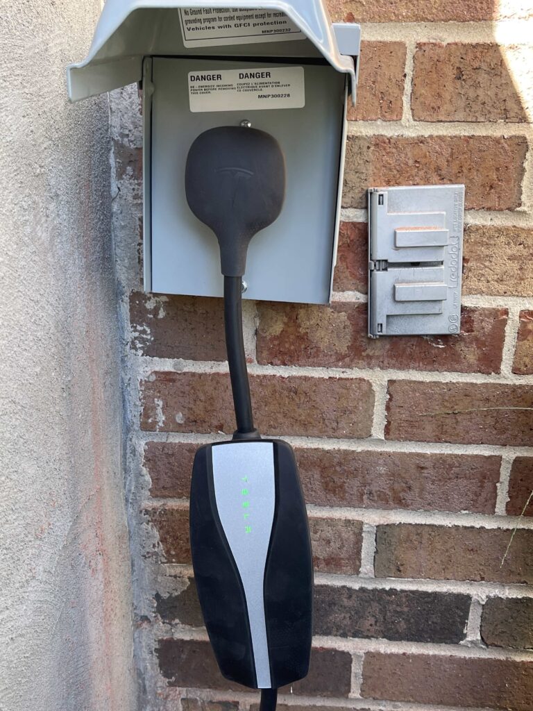 NEMA 14-50 outlet installed in electrical panel for EV charger