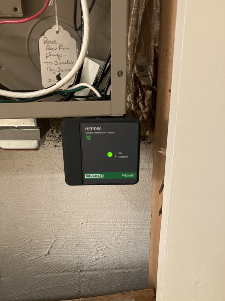 Whole house surge protector (SPD) installed on electrical panel by SparkWise Electric