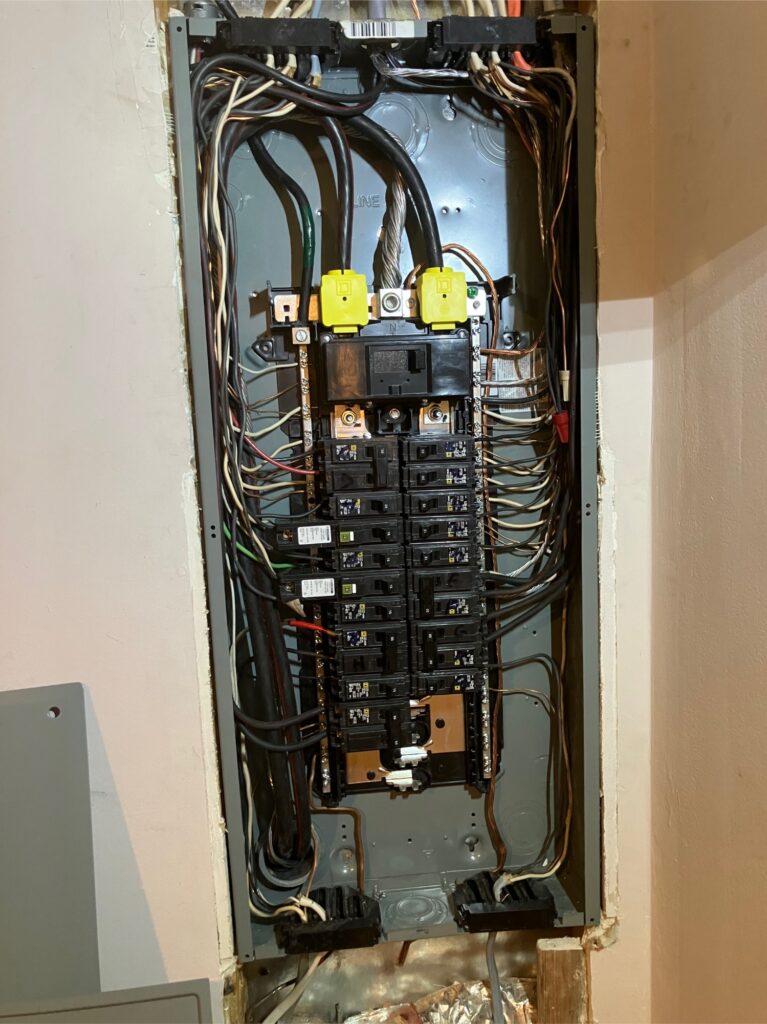 200 amp Square D electrical panel open showing circuit breakers