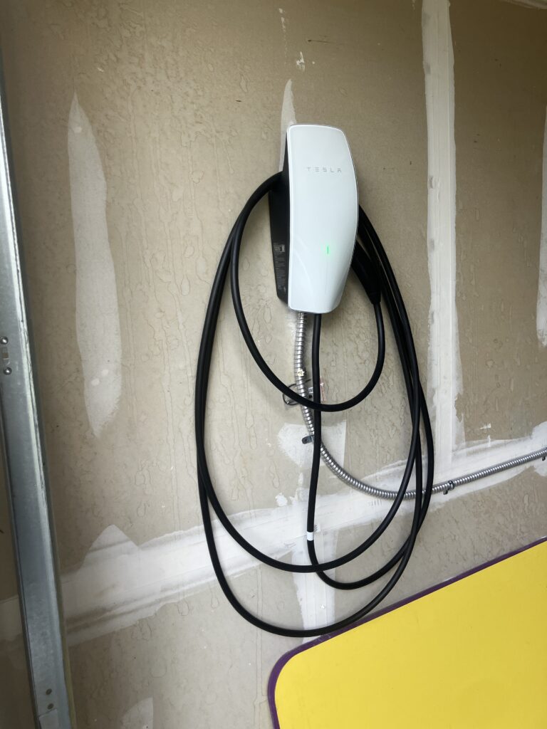 Hardwired Tesla Wall Connector with MC cable — EV charger wiring in Reston, VA by SparkWise Electric