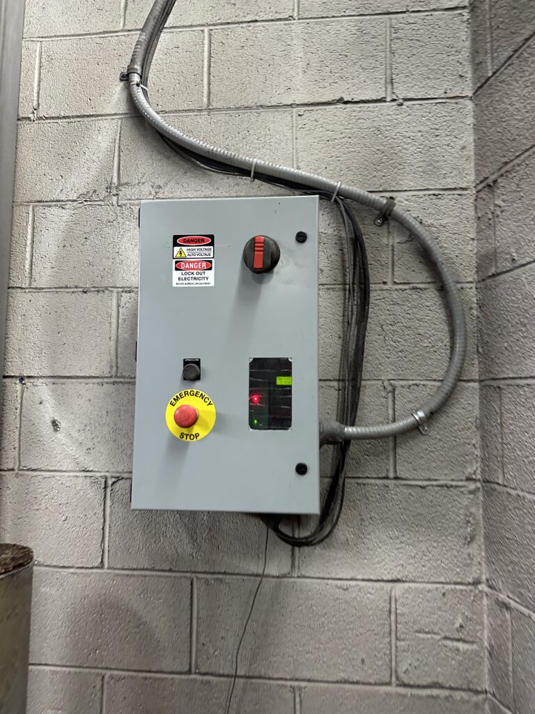 Commercial electrical control panel with emergency stop button installed by SparkWise Electric in Pentagon City Arlington VA