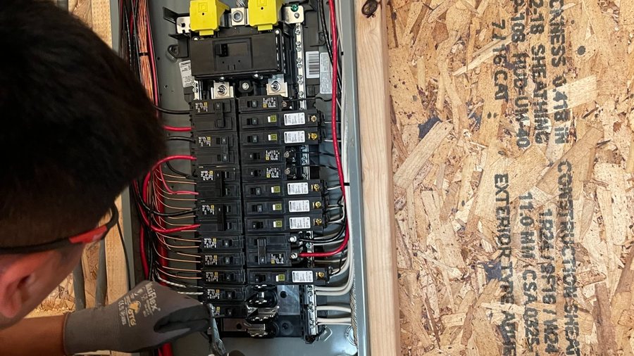 SparkWise electrician installing panel during new construction in Northern Virginia