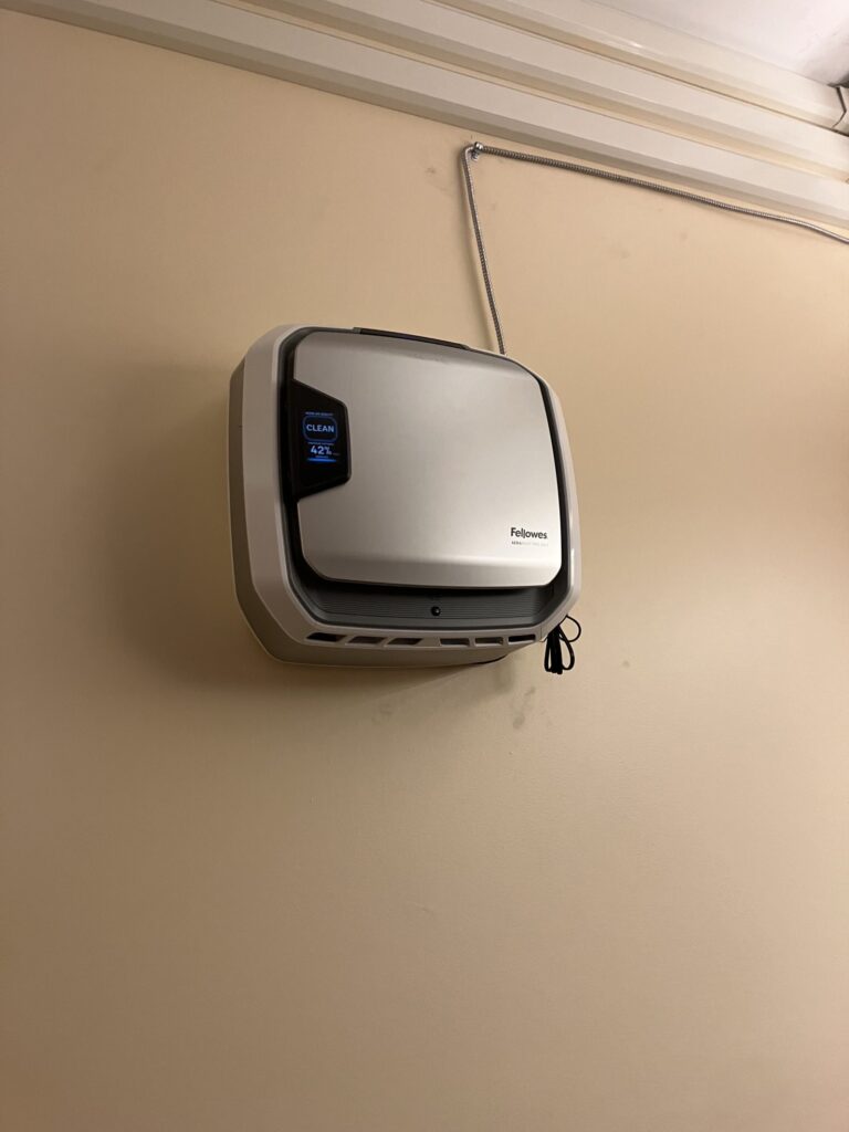Hardwired wall-mounted commercial air purifier installed by SparkWise Electric in Washington DC