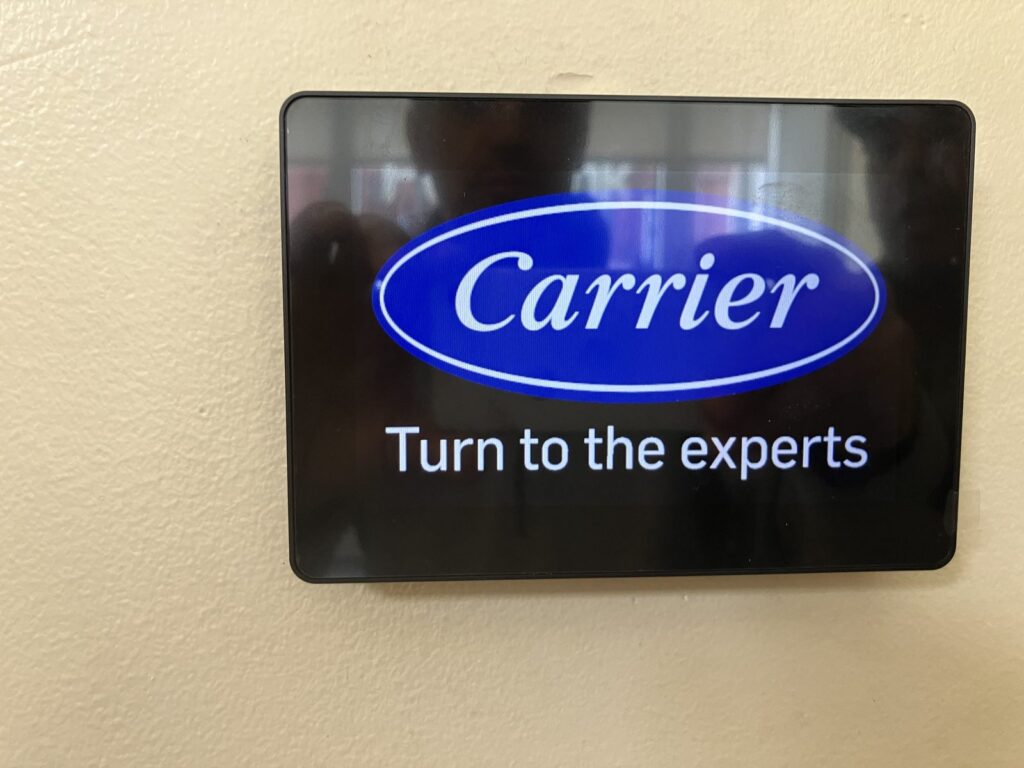 Carrier smart thermostat installed in a Washington DC commercial office by SparkWise Electric