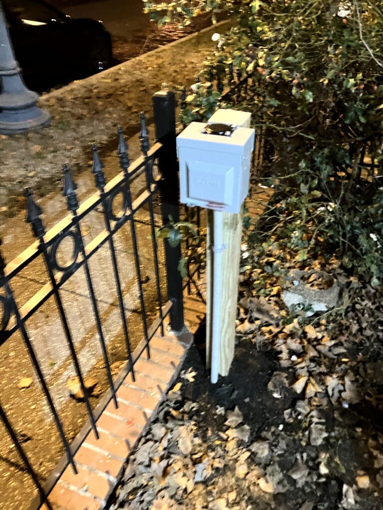 Post-mounted weatherproof 30A EV charger outlet for a Washington DC rowhome by SparkWise Electric