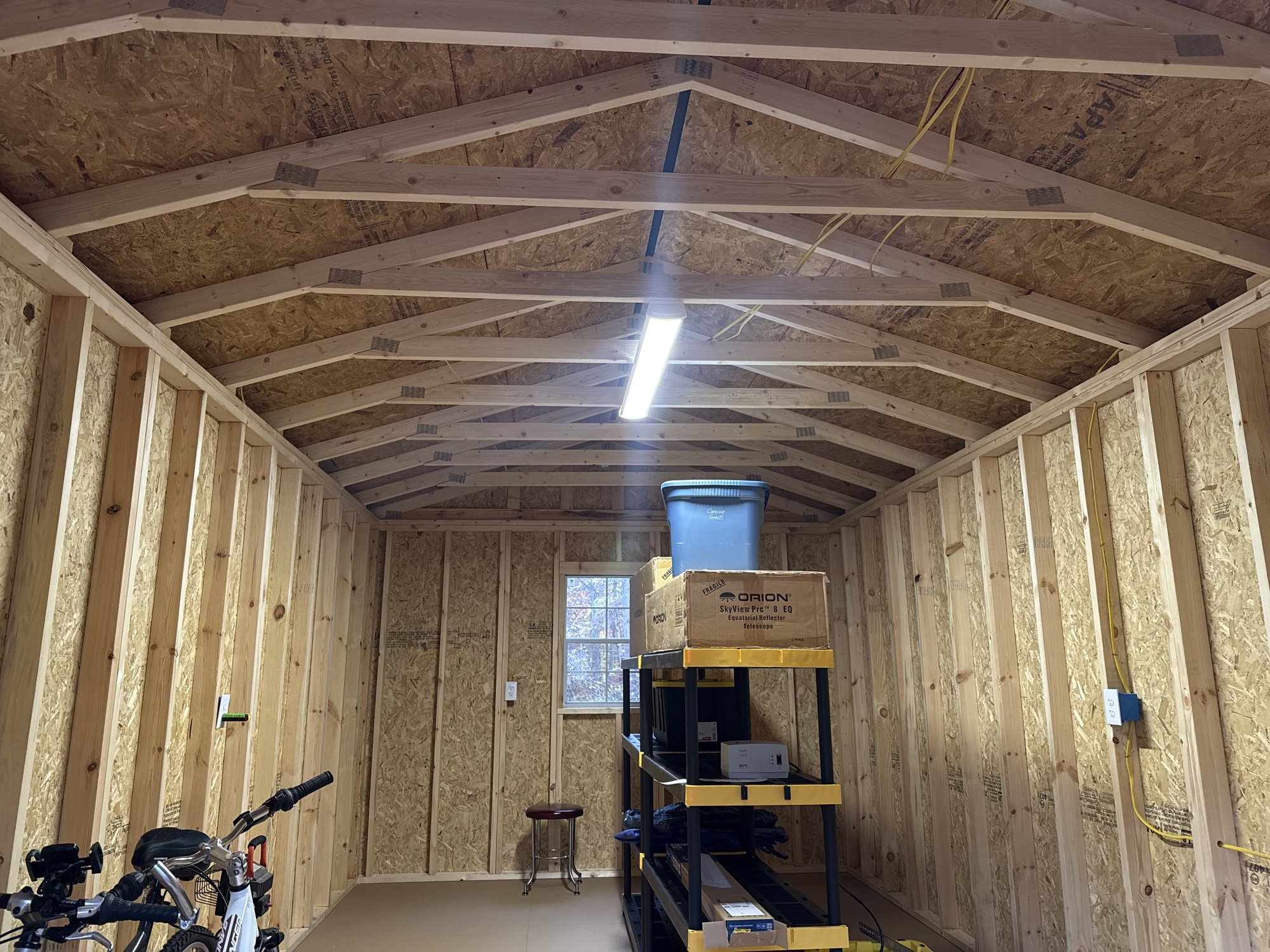 Interior of a shed with new electrical wiring, LED lighting and outlets installed