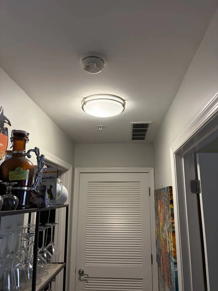 Hallway ceiling light and smoke detector serviced by SparkWise Electric in Alexandria VA