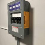 Square D sub-panel installed in an Arlington VA condo with approved Arlington County final inspection sticker – SparkWise Electric