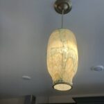 Close-up of art glass pendant light installed by SparkWise Electric in Ashburn VA