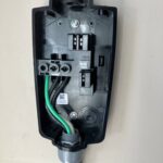 Wiring terminations inside a Tesla Wall Connector during installation by SparkWise Electric in Ashburn VA