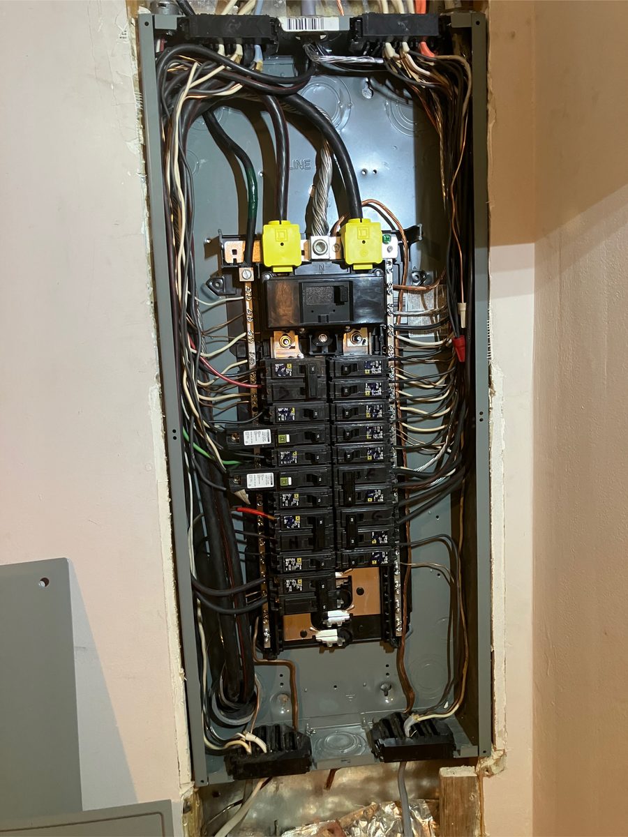 Residential electrical panel with every circuit position filled, wired by SparkWise Electric