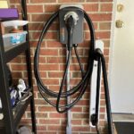 ChargePoint Home Flex EV charger hardwired on a brick garage wall by SparkWise Electric in Fairfax Station VA