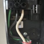 Wiring terminations inside a Tesla Wall Connector during installation by SparkWise Electric in Gainesville VA