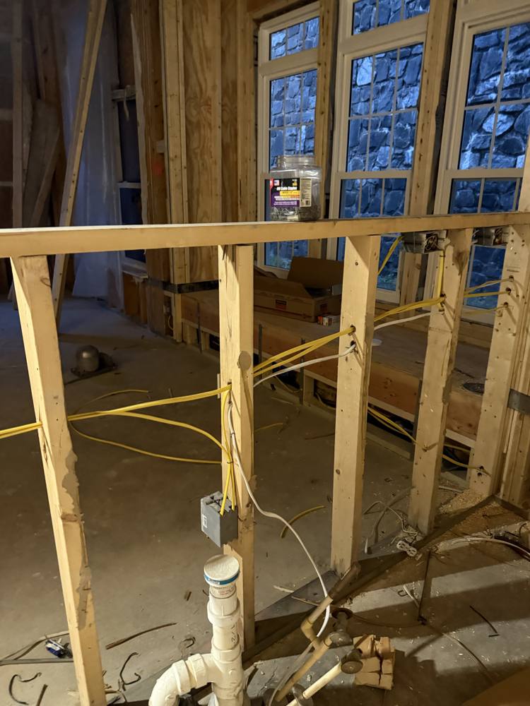 Wall rough-in wiring during a fire recovery rebuild by SparkWise Electric in Manassas Park VA