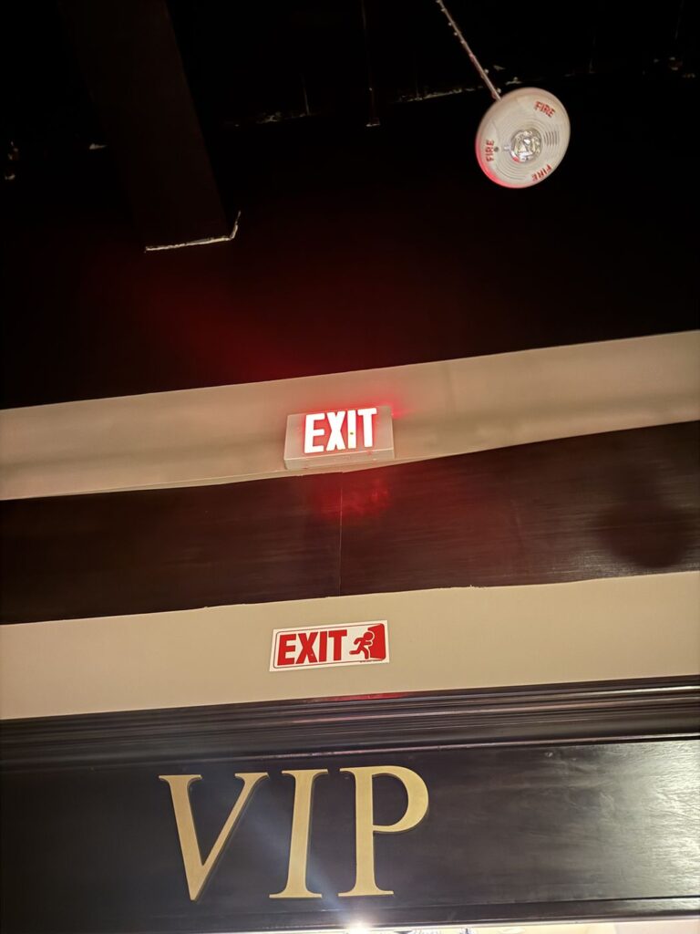 New illuminated exit sign installed above an interior doorway at a Potomac MD commercial space by SparkWise Electric