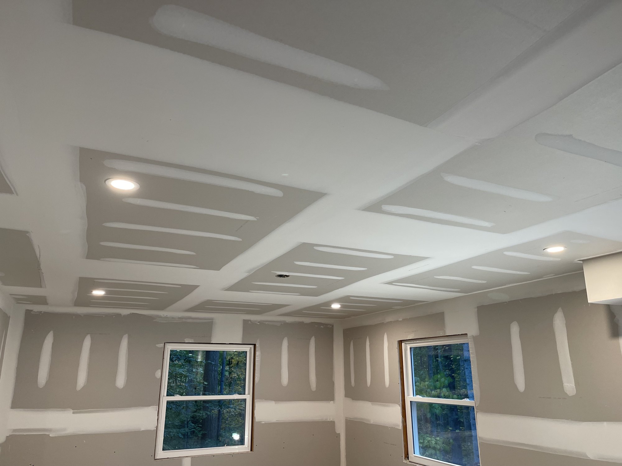 Recessed LED lighting installed in a coffered ceiling by SparkWise Electric in Northern Virginia