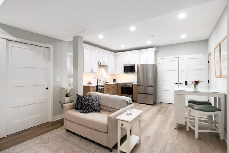 Recessed lighting in an open-plan living and kitchen space installed by SparkWise Electric