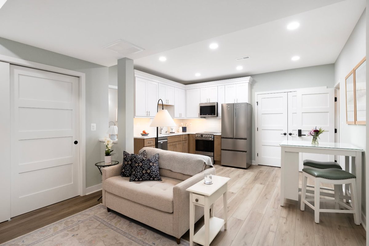 Recessed lighting in an open-plan living and kitchen space installed by SparkWise Electric