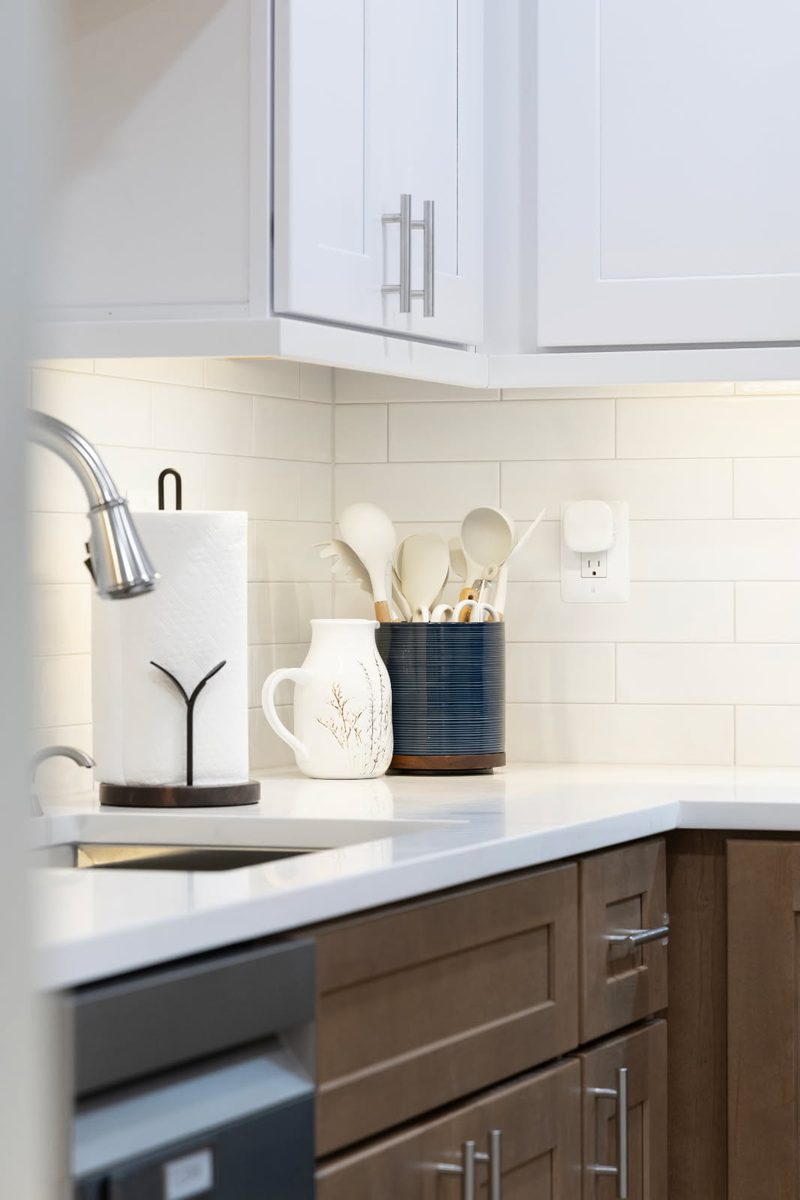 Under-cabinet LED lighting washing a kitchen backsplash, installed by SparkWise Electric