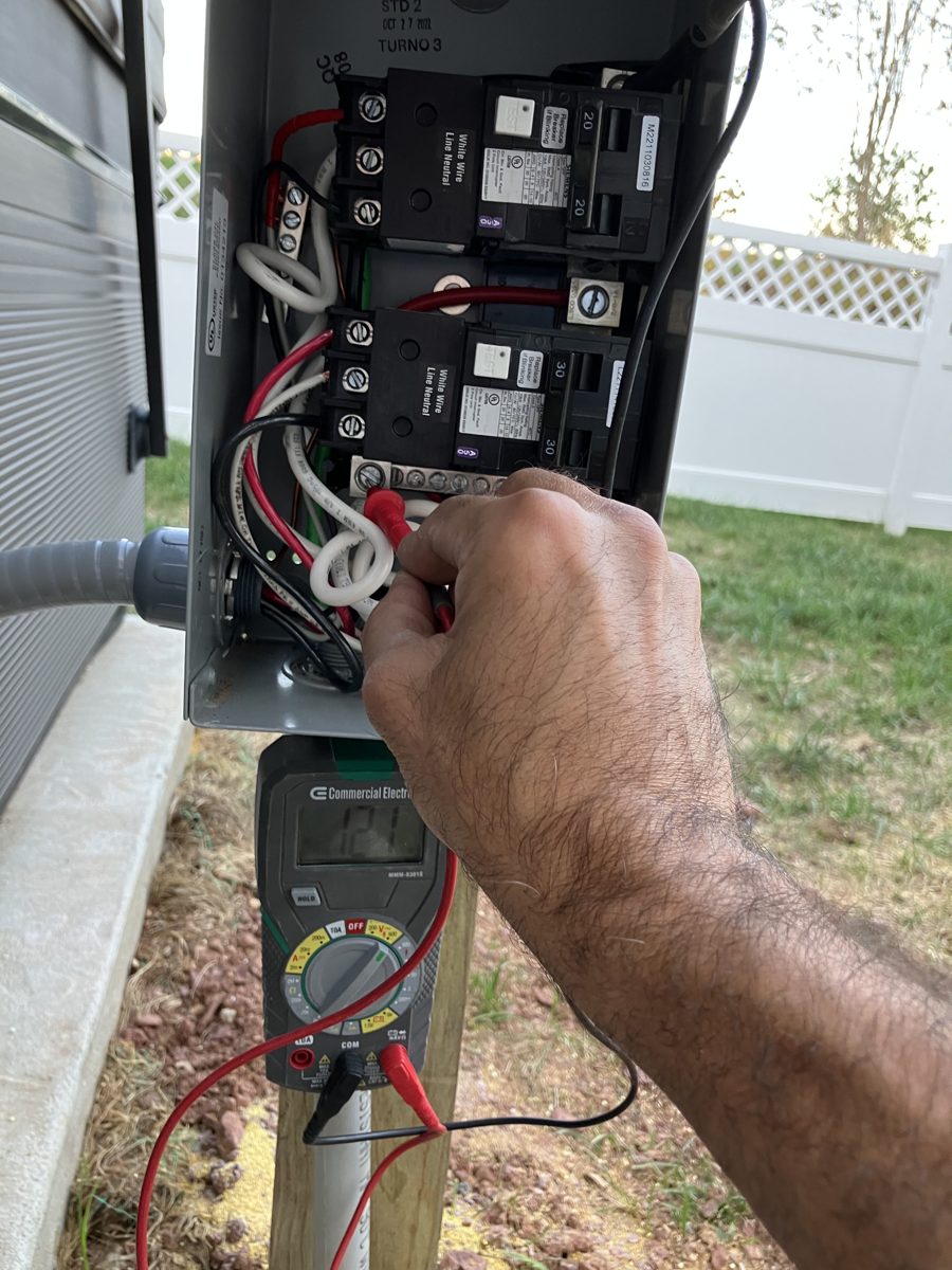 Testing line voltage at the manufacturer-supplied GFCI subpanel of a Caldera spa in Ashburn, VA – SparkWise Electric